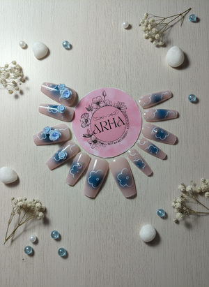 Nail art display with 'ARHA' logo, floral designs, and decorative elements on a light background.