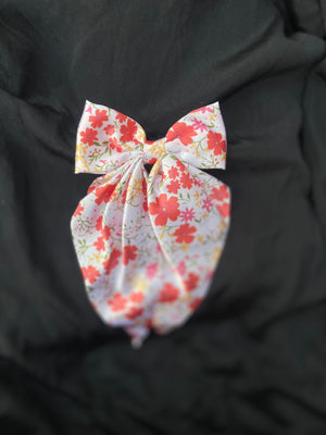 Cherry Blossom floral print satin hair bow clip in white and red."