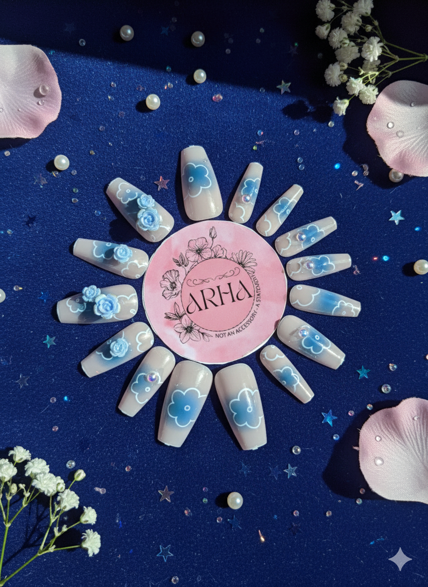 Nail art with floral designs on a blue background, featuring the brand 'ARHA'.