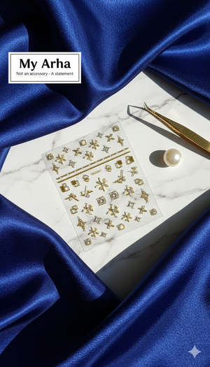 Premium gold and rhinestone geometric nail art stickers displayed on a marble slab with luxury blue satin, featuring a pearl and gold precision tweezers — My Arha DIY Luxury Nail Art.