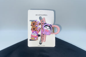 Cartoon character keychains on a card labeled 'Accessories' with a dark background.
