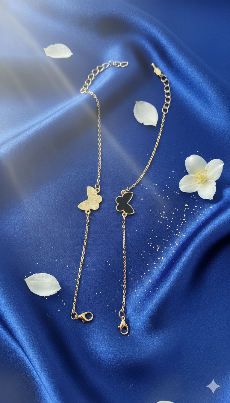 Gold necklace with clover pendants on a blue satin background with white flowers.